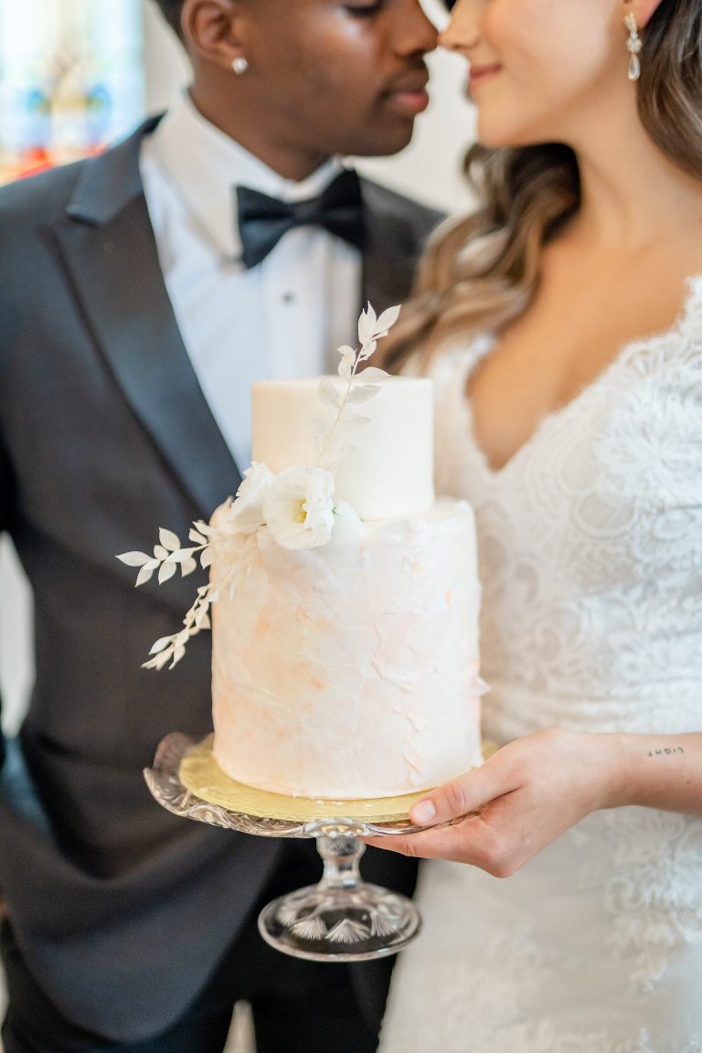 La Petite Chapelle Styled Shoot Couple holding cake 768x1152