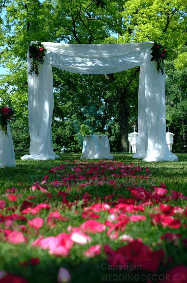 Wedding Decor Toronto aisle decor outdoor white Chuppah with fresh florals rentals toronto 768x1158