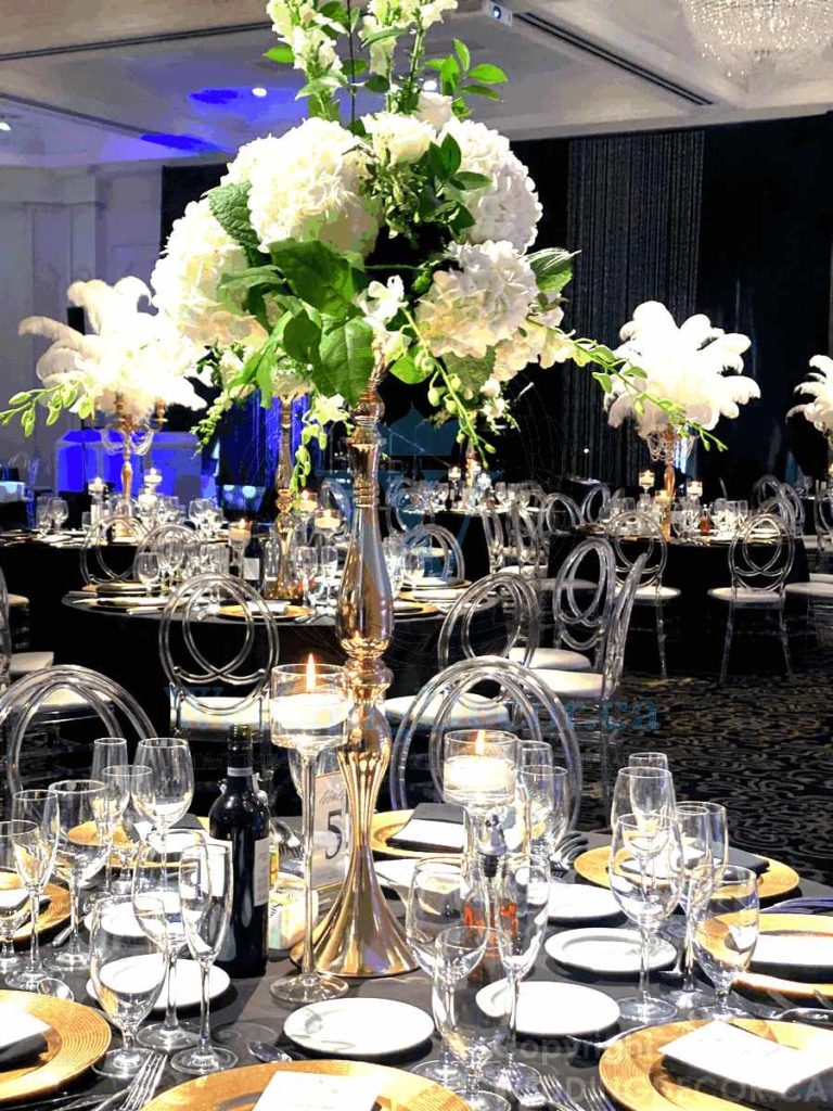 Wedding Decor Toronto centerpiece rentals tall clear curvy vase with white hydrangea white roses 768x1024